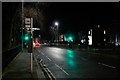 Bus stop and pedestrian crossing on Albyn Place at night