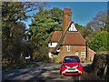 Beauvale Lodge and a small red car