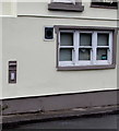 Grey postbox in a Main Road wall, Tyntetown