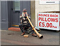 A didgeridoo player in Galashiels