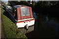 View of a narrowboat reflected in the Grand Union Canal at Southall #2