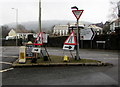 Temporary road signs on a triangle in Treforest