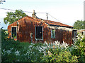 Derelict tin house