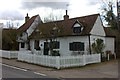 White timber house in Roydon High St