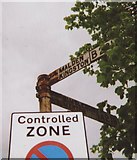 TQ2371 : Old Direction Sign - Signpost on the A219 High Street Wimbledon by Milestone Society