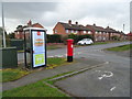 Elizabeth II postbox and telephone box on Wrexham Road, Whitchurch