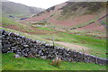 NY7027 : Great Rundale Beck viewed over moorland wall by Roger Templeman