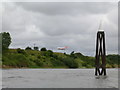 SJ4481 : Jet landing at Liverpool from Hale Cliff Wharf by Andy Davis