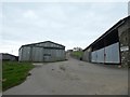 Barns at East Acland and sign to Acland Barton