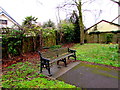 Bench on a green in the centre of Marshfield