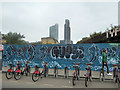 TQ3382 : Hire bikes and graffiti, Brick Lane, E1 by Robin Webster