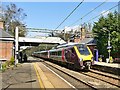 Cross Country train passing through Poynton Station