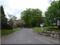 Standing in Ockham Lane and looking towards the driveway to Hatchford Manor