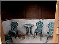 Furniture inside a bus shelter, Llangrove, Herefordshire