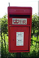 SJ3953 : Close up, Elizabeth II postbox on Rossett Road, Holt by JThomas