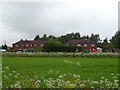 Crop field and houses, Uckington Heath