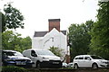 View of a large house on Thicket Road from the entrance to Crystal Palace Park