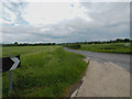 Junction with minor road towards  Watton or Carbrooke