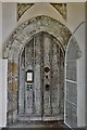 Great Bromley, St. Georges Church: South doorway with figures of Adam and Eve above