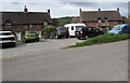 Houses and cars at the eastern edge of Llangrove, Herefordshire