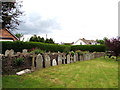 Row of gravestones in Christ Church churchyard, Llangrove, Herefordshire