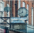 Temple Fortune : clock and shop sign