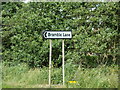 TF5005 : Signpost on the A1101 Outwell Road by Geographer