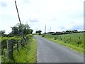 Leaning telegraph poles at the Tullygeasy and Tullyneill cross roads