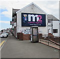 M2 estate agents advert on a Chepstow Road corner, Newport