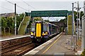 Train arriving at Platform 3 under the temporary bridge at Kilwinning Railway Station