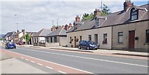 J0508 : Terraced cottages on the R132 (Newry Road) by Eric Jones