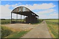 NZ3725 : Roadside dutch barn, Shotton by Graham Robson
