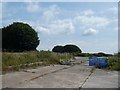 Entrance to former business site, by A35