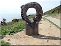 Fishy sculpture pointing the way to Langland Beach