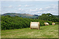 Farmland with hay bales near Newbridge-on-Wye, Powys