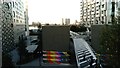 View of a Jubilee line ventilation shaft covered in colourful art from The Tide