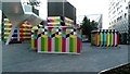 View of a Jubilee line ventilation shaft covered in colourful art