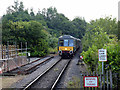 A diesel train approaching Stogumber station