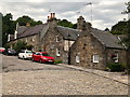 Granite Cottages and Cobbled Road leading off Brig o