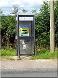 NY6818 : Uses for an old telephone box at Burrells by Oliver Dixon