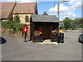 Elizabeth II postbox and bus shelter on Stocks Hill Silverstone