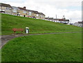 Bench and litter bin on a green, Gilfach