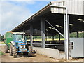 Cattle feeding shed with silage dispenser ready to feed near Preston