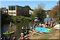 Canoes and wake boarders at River Rother