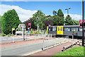 Metro train at level crossing