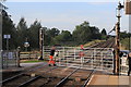 Manually operated level crossing