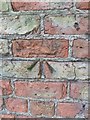 Benchmark on a barn in Kiplin