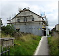 Scaffolding and metal sheeting on Hengoed Chapel in August 2019