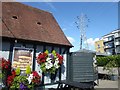 Hanging baskets and a pylon