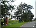 Phone box and bus stop by A39 on edge of Kilkhampton